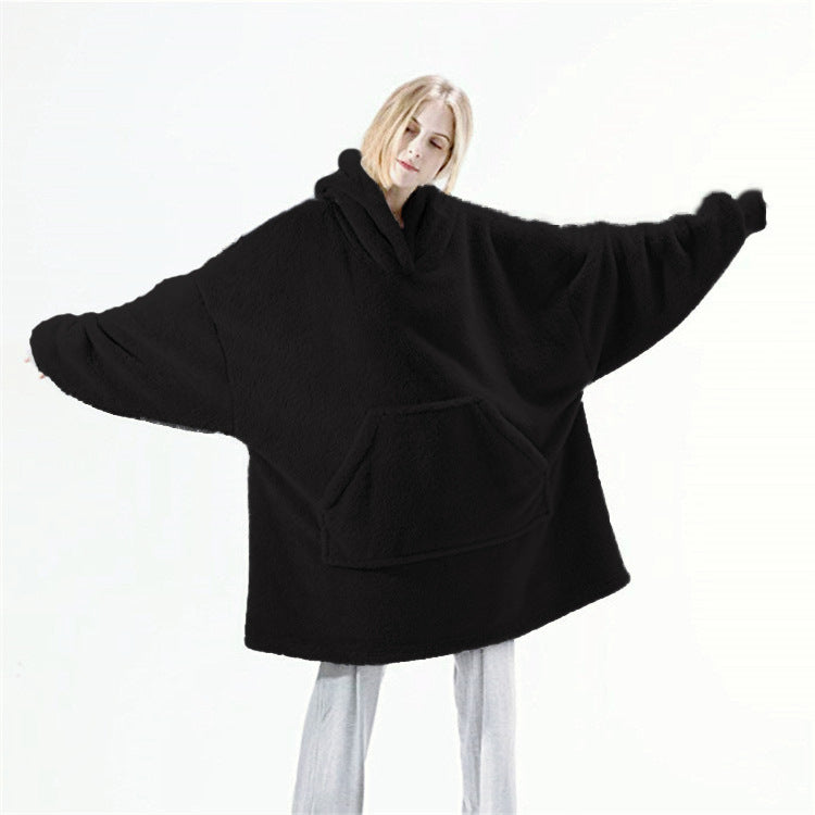 Person wearing oversized plush blanket hoodie