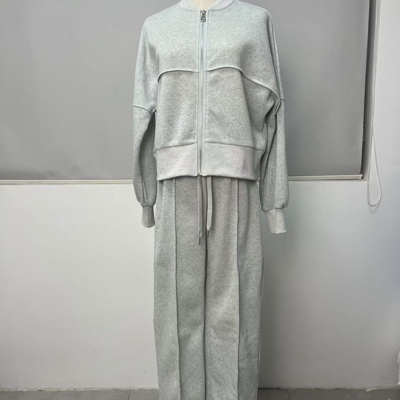 Woman in a zip jacket and wide-leg pants set