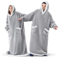 Oversized sherpa hoodie blanket on the couch