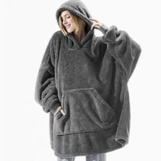 Person wearing oversized plush blanket hoodie