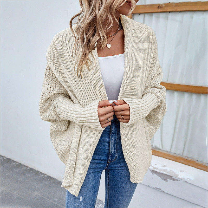 Woman in oversized batwing knit cardigan