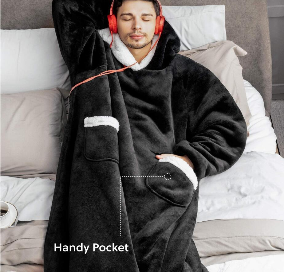 Oversized sherpa hoodie blanket on the couch