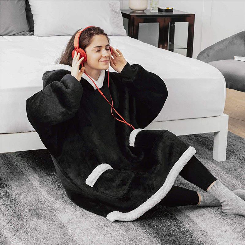 Oversized sherpa hoodie blanket on the couch