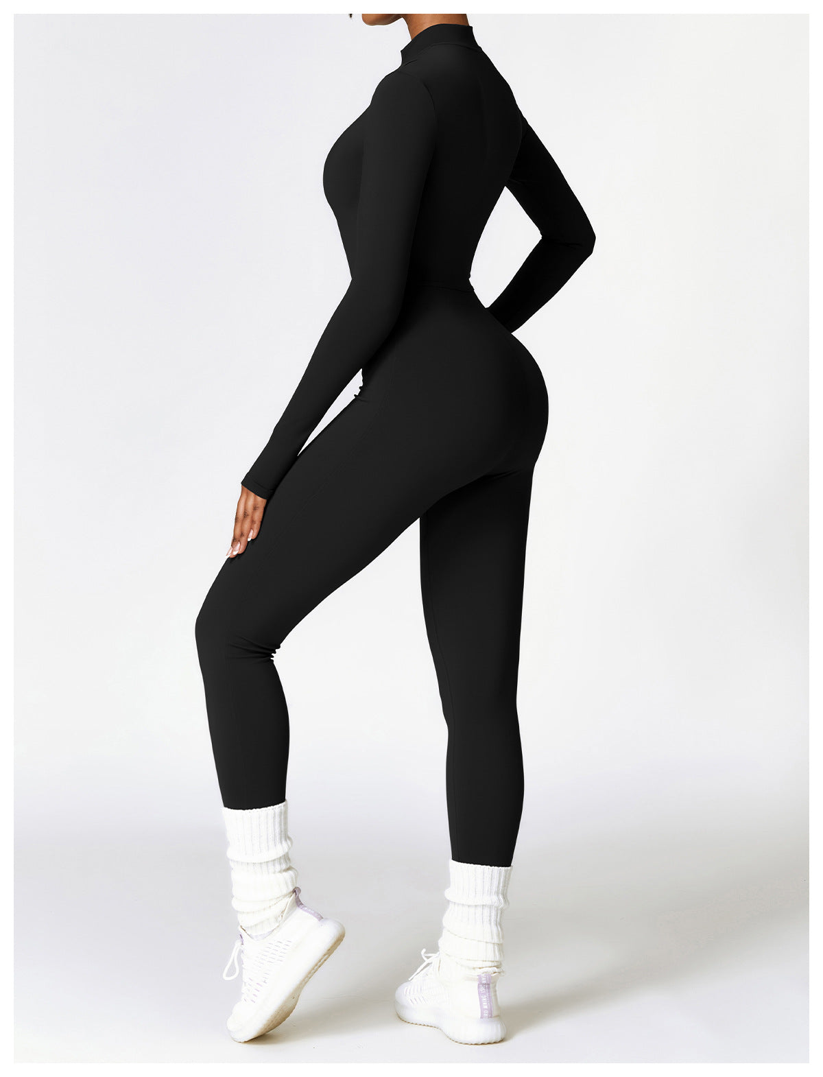 Woman in a zip-front yoga jumpsuit
