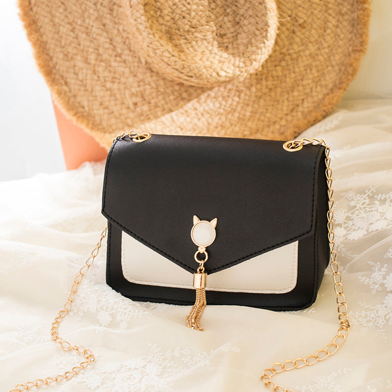 Small square crossbody bag with cat clasp