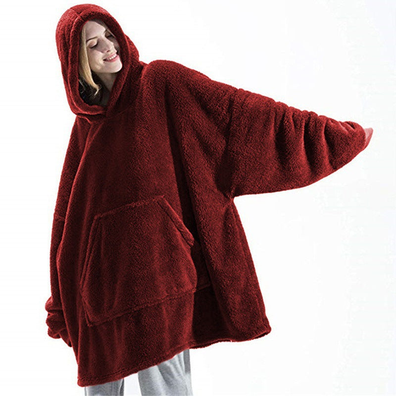 Person wearing oversized plush blanket hoodie