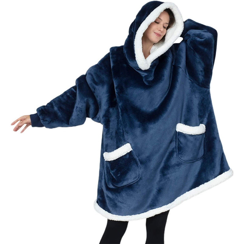 Oversized sherpa hoodie blanket on the couch